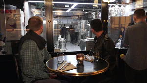 Diners Observing Meat Manufacturing As They Await Their Food